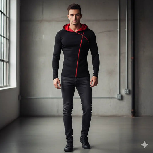 Man wearing a black and red hoodie in an industrial setting